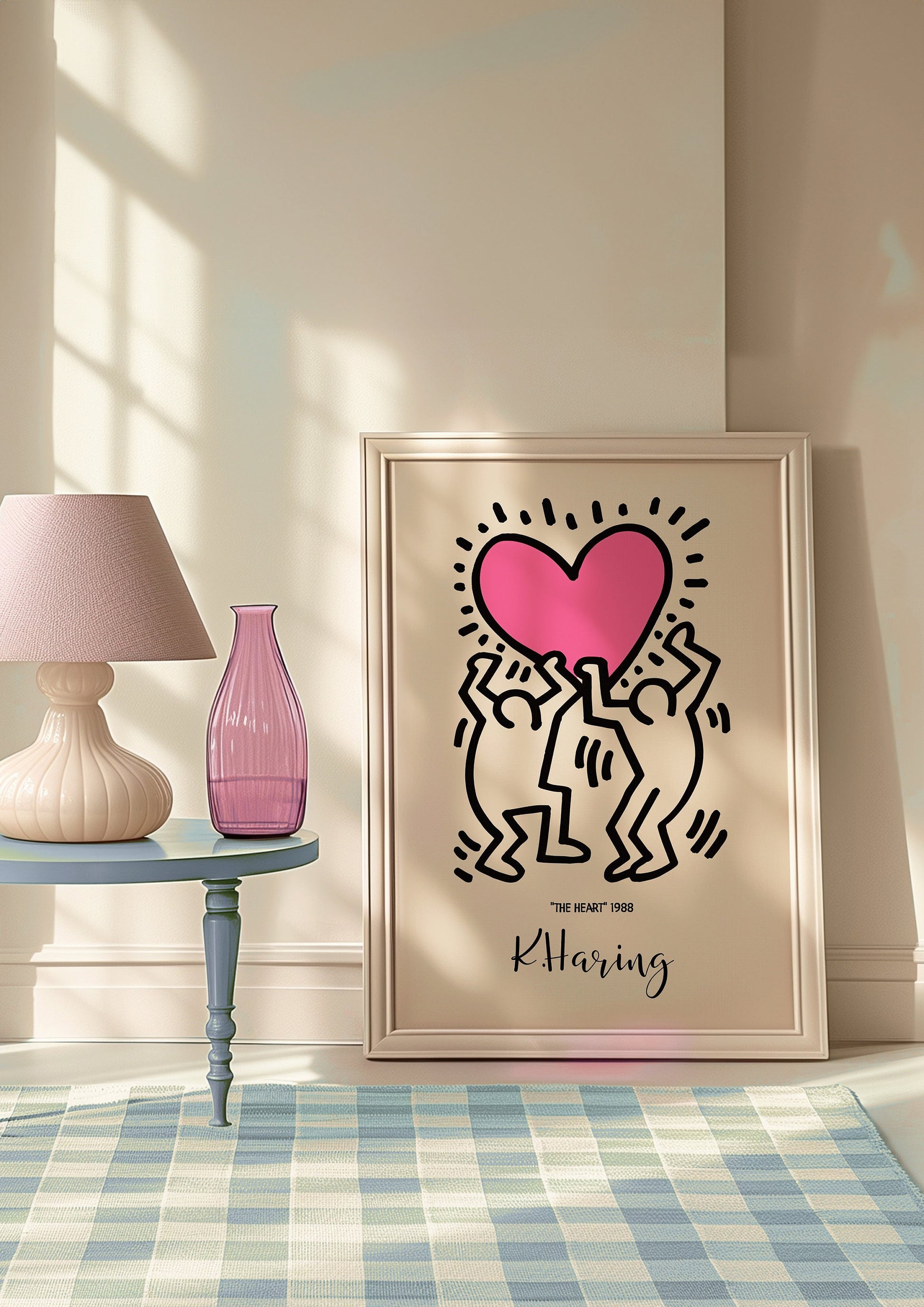 Keith Haring&#39;s &quot;The Heart&quot; 1988 poster, featuring two figures holding a bold pink heart, framed in a warm, minimalist space with soft lighting and modern decor elements.